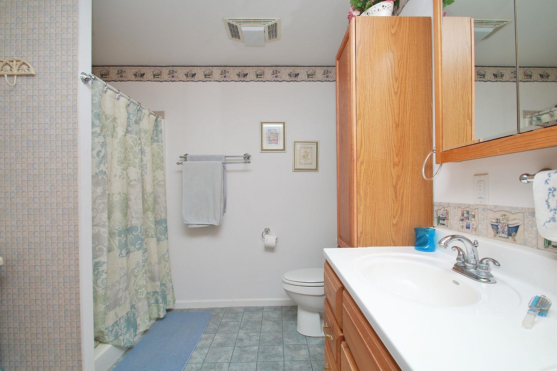 5965 Horseshoe Bend Road Goodview, VA 24095 - Photo 23 of 33 a bathroom with a sink a toilet and shower