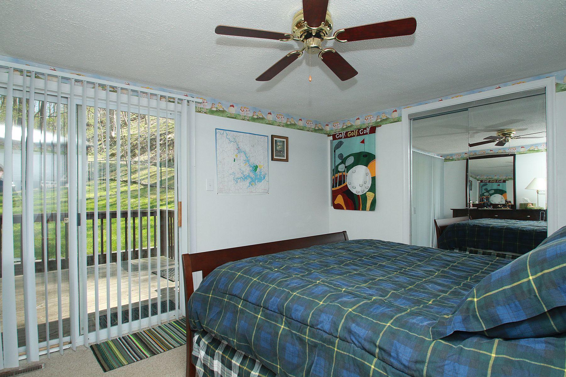 5965 Horseshoe Bend Road Goodview, VA 24095 - Photo 26 of 33 a bedroom with a large bed and a large mirror