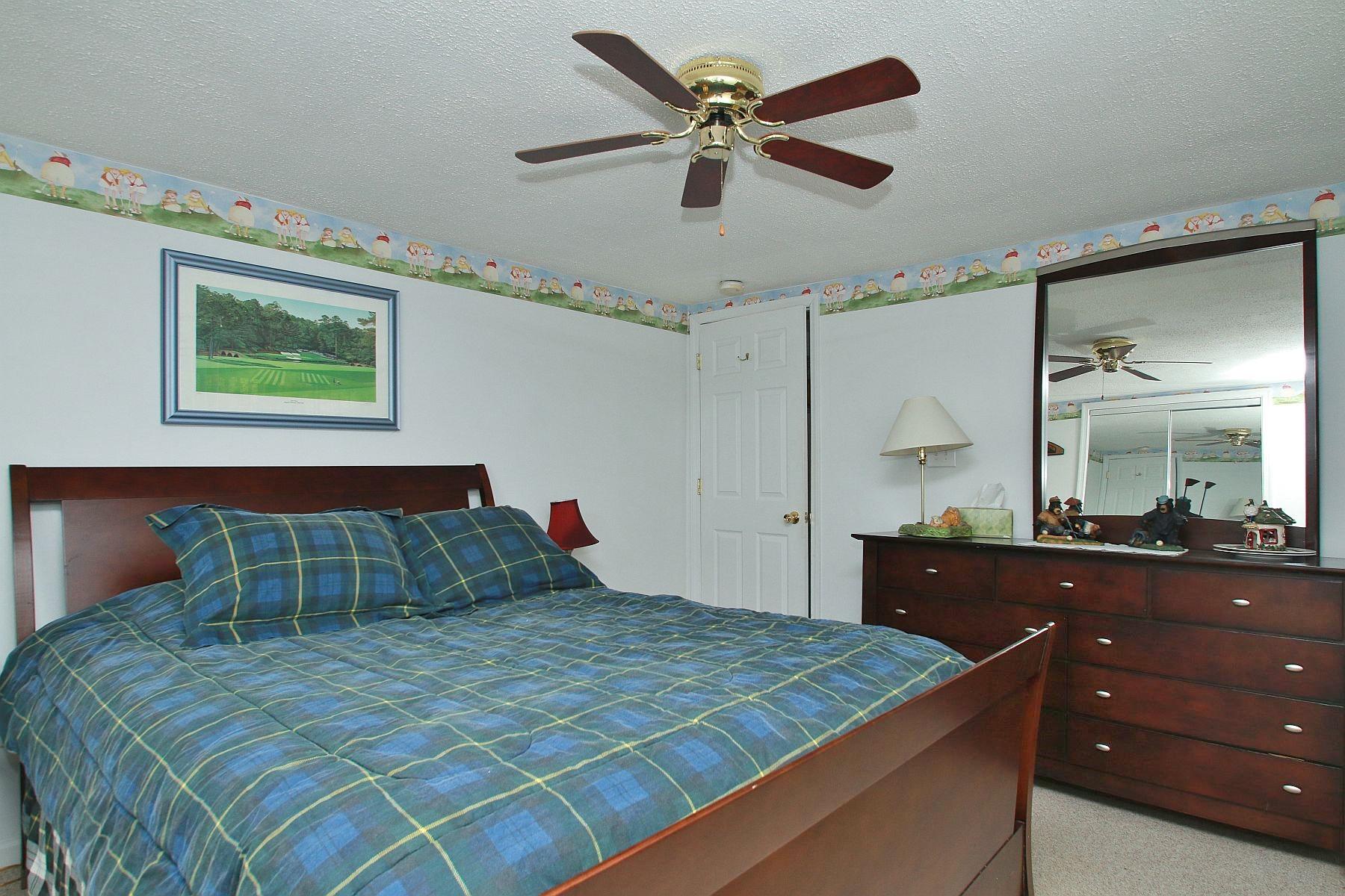 5965 Horseshoe Bend Road Goodview, VA 24095 - Photo 27 of 33 a bedroom with a bed and a dresser