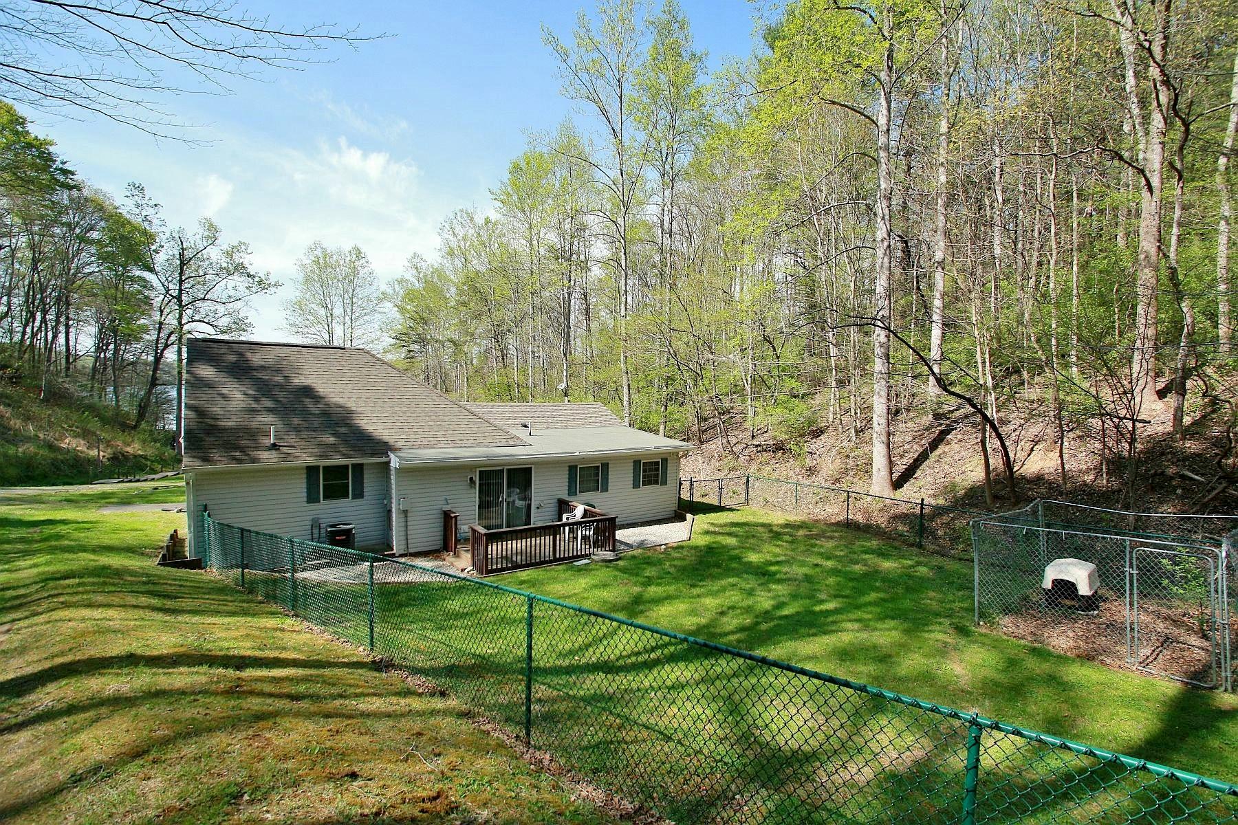 5965 Horseshoe Bend Road Goodview, VA 24095 - Photo 28 of 33 a view of a house with pool and a yard