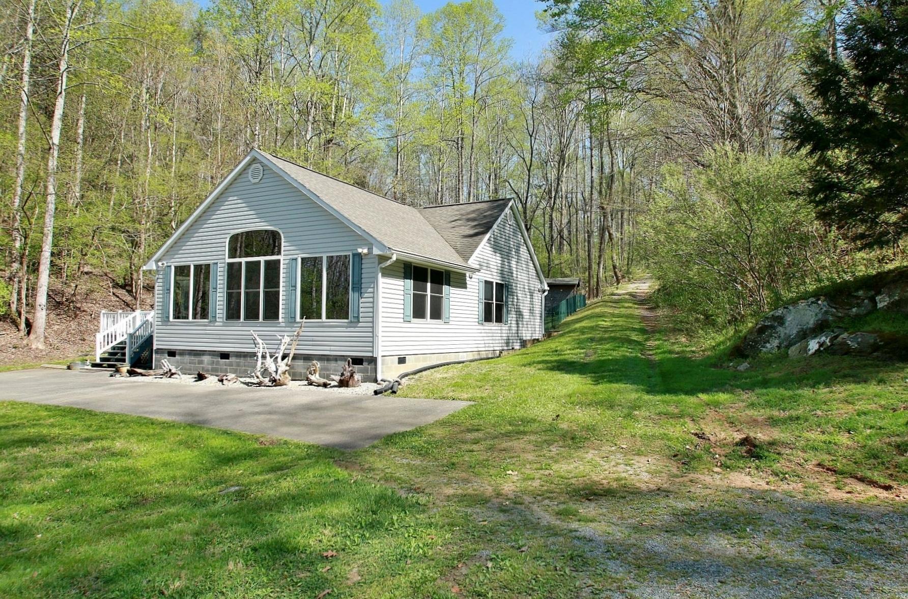 5965 Horseshoe Bend Road Goodview, VA 24095 - Photo 29 of 33 a front view of a house with yard and green space