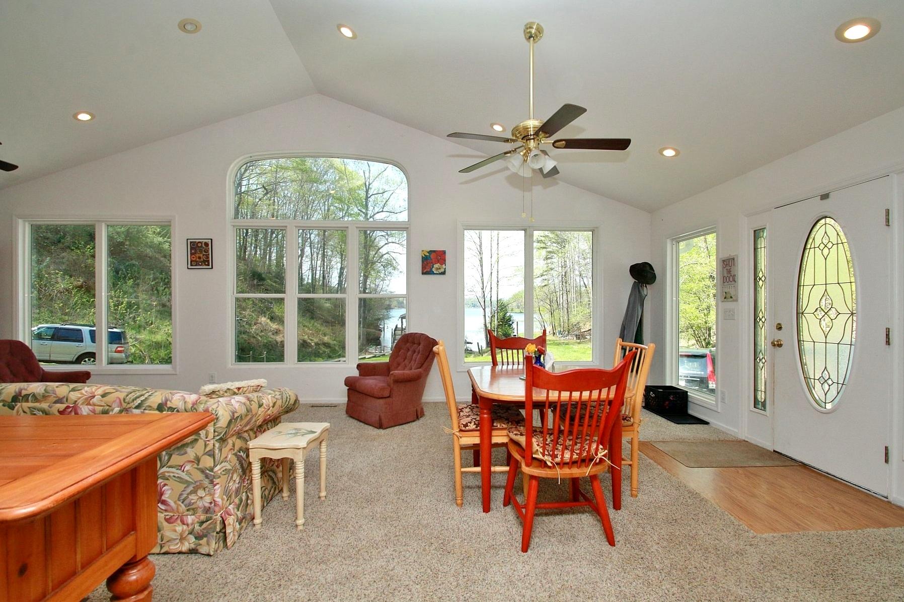 5965 Horseshoe Bend Road Goodview, VA 24095 - Photo 30 of 33 a dining room with furniture and a large window