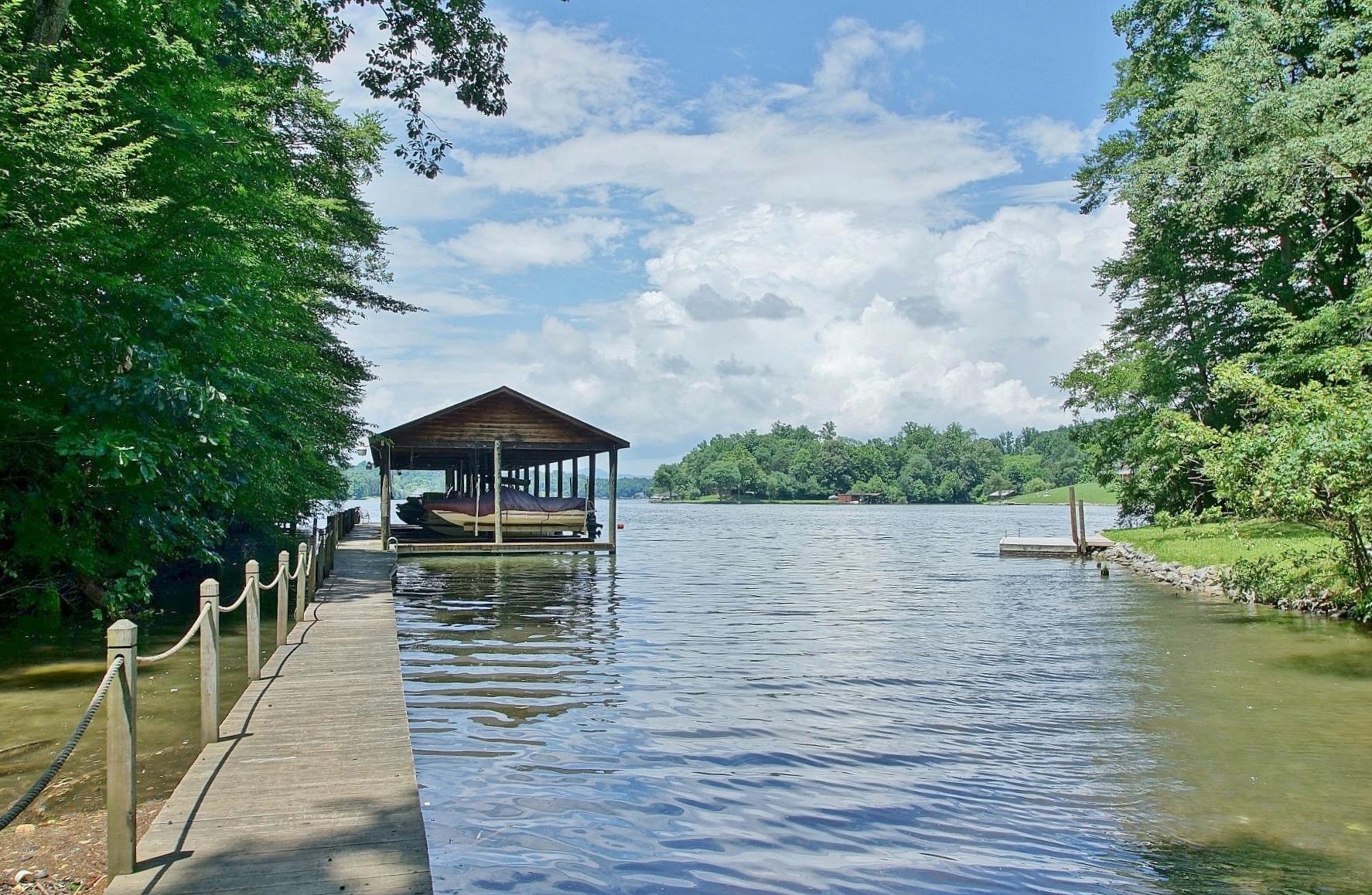 5965 Horseshoe Bend Road Goodview, VA 24095 - Photo 5 of 33 a view of a lake with a deck