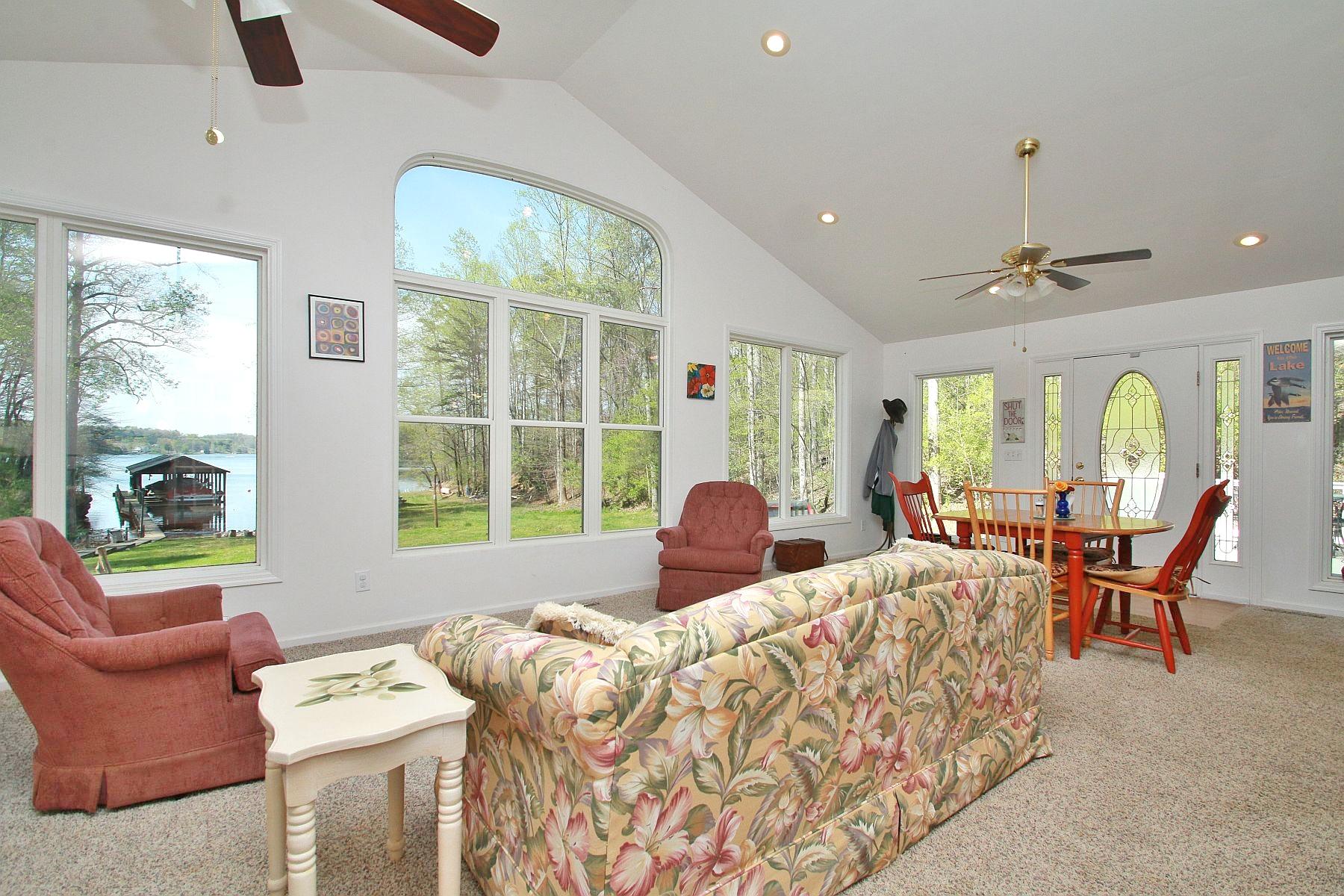 5965 Horseshoe Bend Road Goodview, VA 24095 - Photo 10 of 33 a bedroom with furniture and a large window