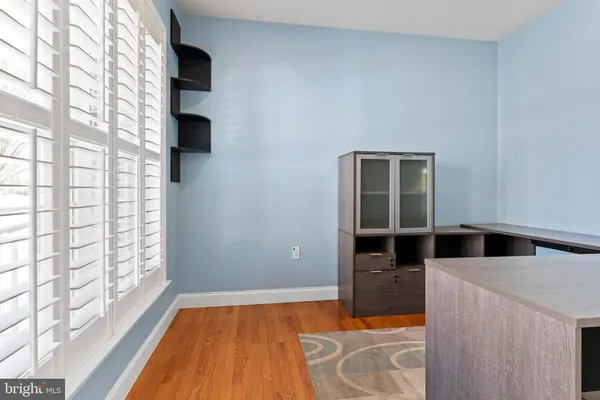 a room with bed and cabinets