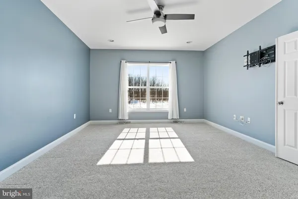 a big room with windows and closet