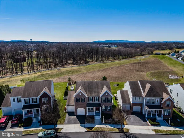 an aerial view of houses with street