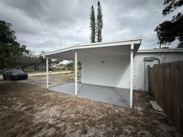 a view of a parking space in front of a house