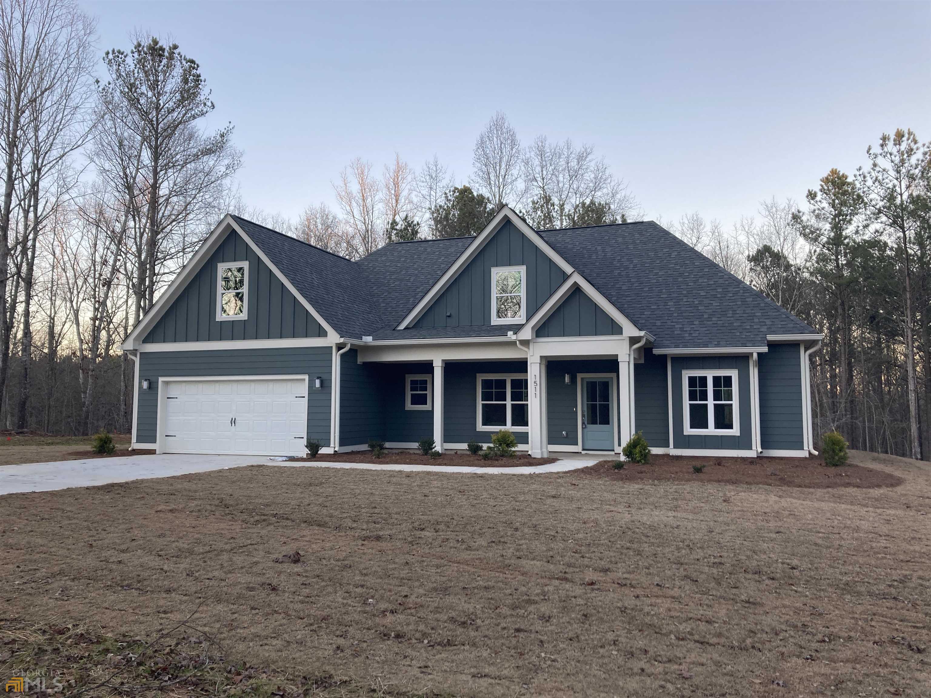 1511 Aqua Road Madison, GA 30650 - Photo 1 of 1 front view of a house with a yard