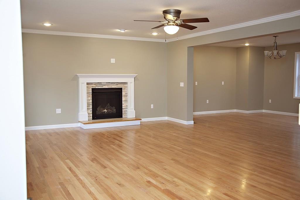 Lot 12 Crow Hill Road Monson, MA 01057 - Photo 4 of 19 a view of an empty room with a fireplace and a chandelier fan
