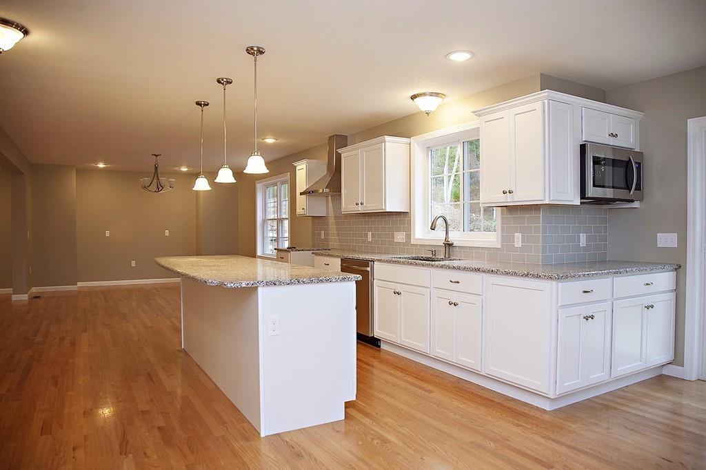Lot 12 Crow Hill Road Monson, MA 01057 - Photo 6 of 19 a large kitchen with granite countertop a sink a counter space appliances and cabinets