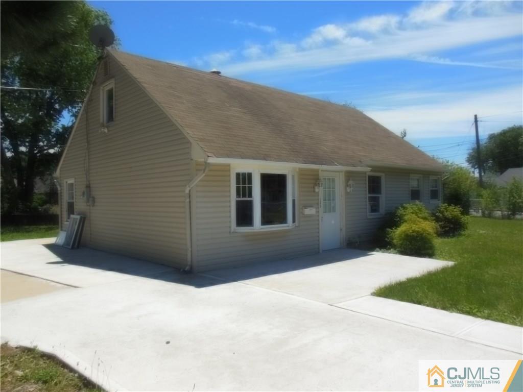 133 Idlewild Road Edison, NJ 08817 - Photo 3 of 11 a view of a house with a yard