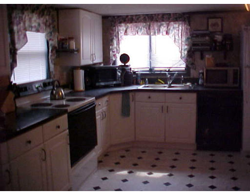 2014 Cross Street Three Rivers, MA 01080 - Photo 5 of 5 a kitchen with a sink and cabinets