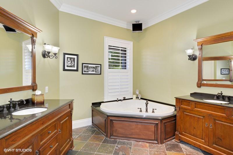 645 Inlet Road North Palm Beach, FL 33408 - Photo 12 of 35 a bathroom with a tub sink and mirror