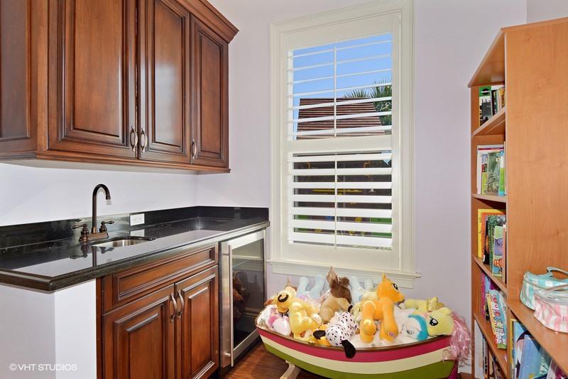 645 Inlet Road North Palm Beach, FL 33408 - Photo 14 of 35 a kitchen with stainless steel appliances granite countertop a sink and a window