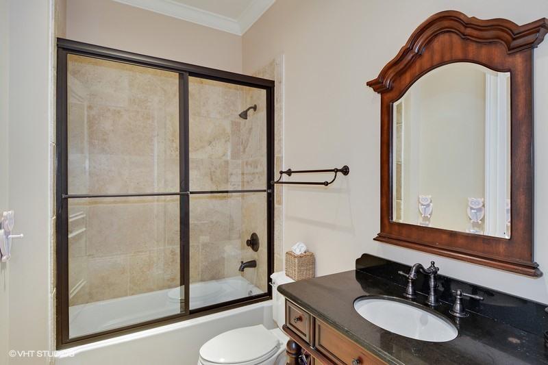 645 Inlet Road North Palm Beach, FL 33408 - Photo 17 of 35 a bathroom with a sink a toilet and a mirror