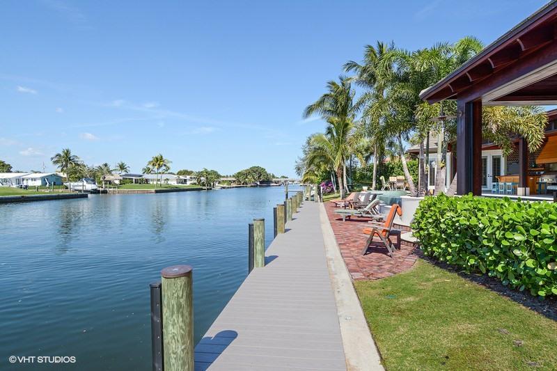645 Inlet Road North Palm Beach, FL 33408 - Photo 19 of 35 a view of a lake with sitting area