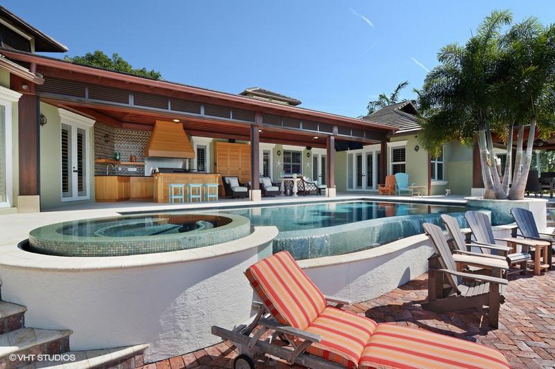 645 Inlet Road North Palm Beach, FL 33408 - Photo 23 of 35 a view of a patio with couches table and chairs and potted plants