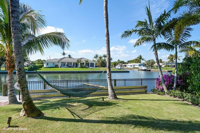 645 Inlet Road North Palm Beach, FL 33408 - Photo 26 of 35 a view of swimming pool with a garden