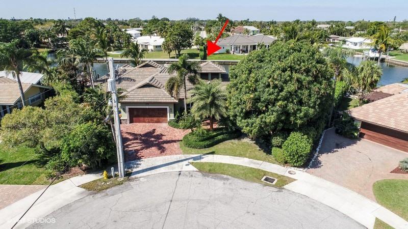 645 Inlet Road North Palm Beach, FL 33408 - Photo 27 of 35 an aerial view of a house with a yard and table and chairs