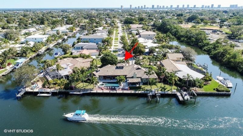 645 Inlet Road North Palm Beach, FL 33408 - Photo 34 of 35 an aerial view of water body with boats and residential houses with outdoor space