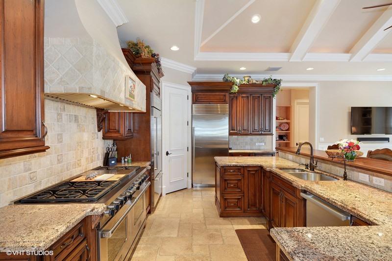 645 Inlet Road North Palm Beach, FL 33408 - Photo 5 of 35 a kitchen with stainless steel appliances granite countertop a sink stove and refrigerator