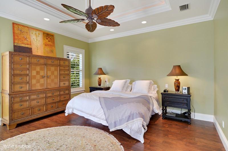 645 Inlet Road North Palm Beach, FL 33408 - Photo 10 of 35 a bedroom with a bed and a cabinets