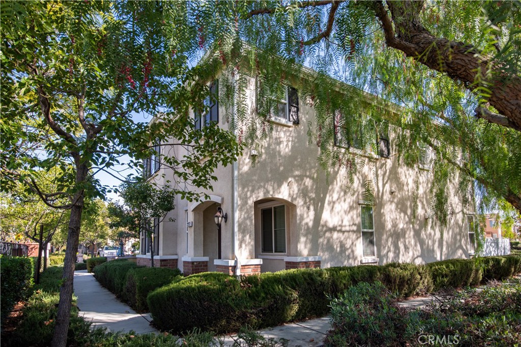 22272 Yorke Road Moreno Valley, CA 92553 - Photo 1 of 1 a front view of a house with a garden