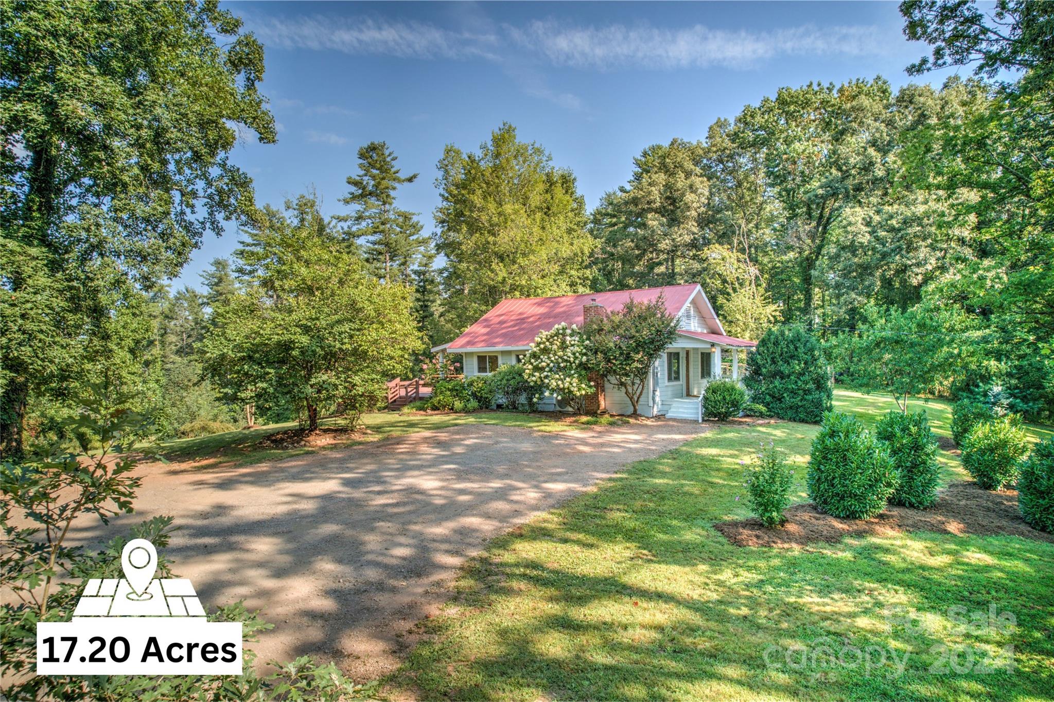 911 Jupiter Road Weaverville, NC 28787 - Photo 2 of 39 a backyard of a house with a yard and outdoor seating