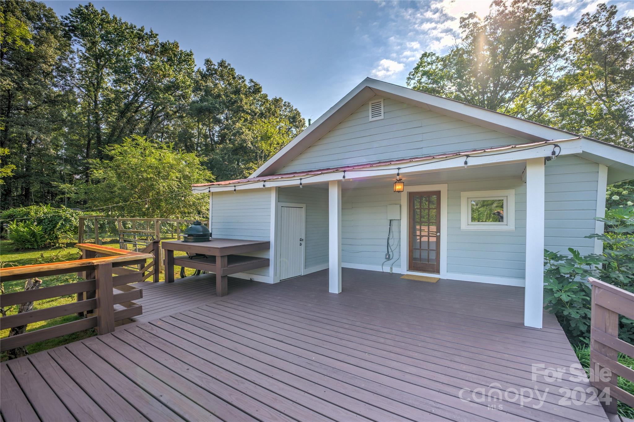 911 Jupiter Road Weaverville, NC 28787 - Photo 21 of 39 a view of a house with backyard and sitting area