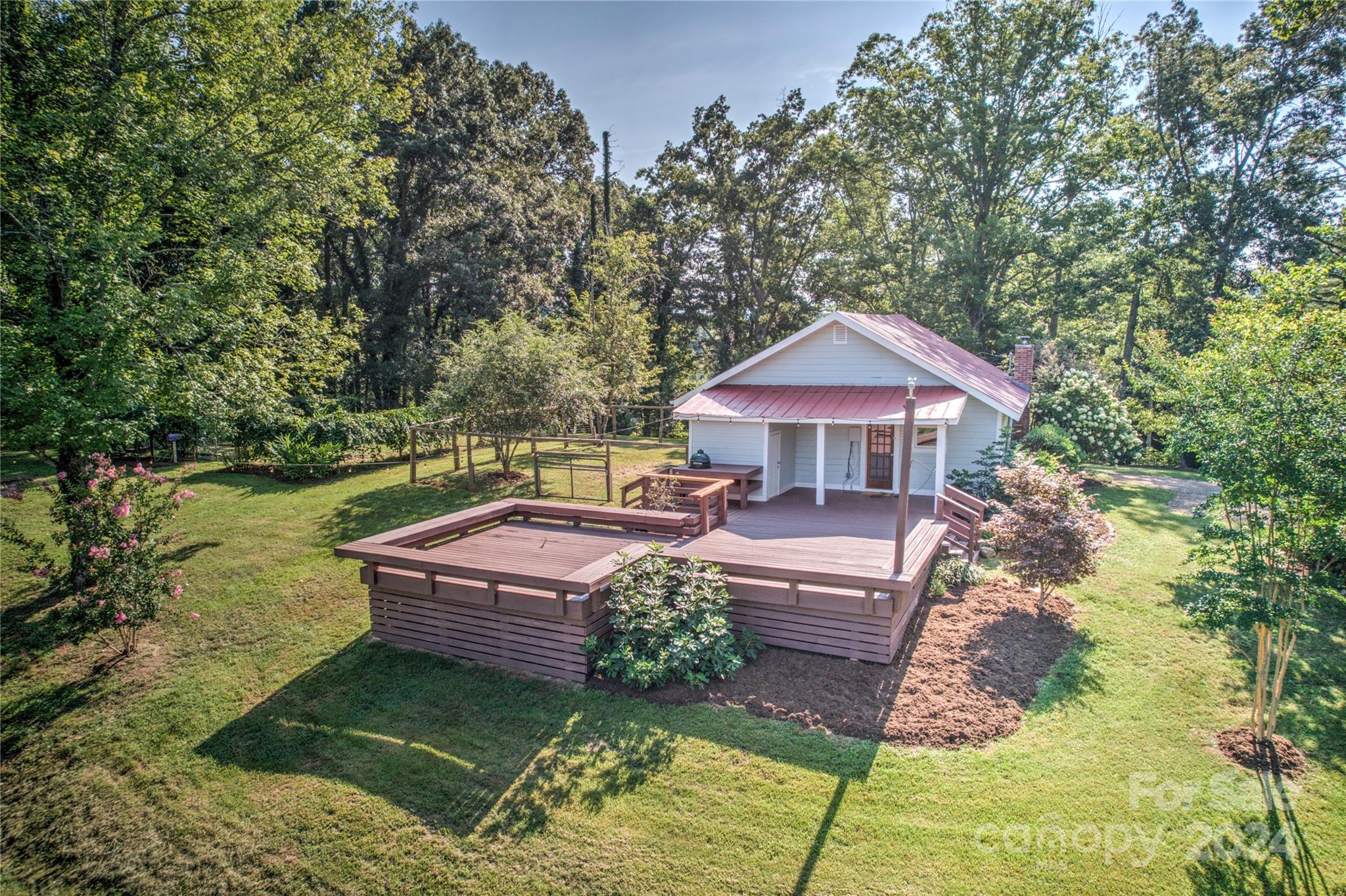 911 Jupiter Road Weaverville, NC 28787 - Photo 22 of 39 a front view of a house with garden