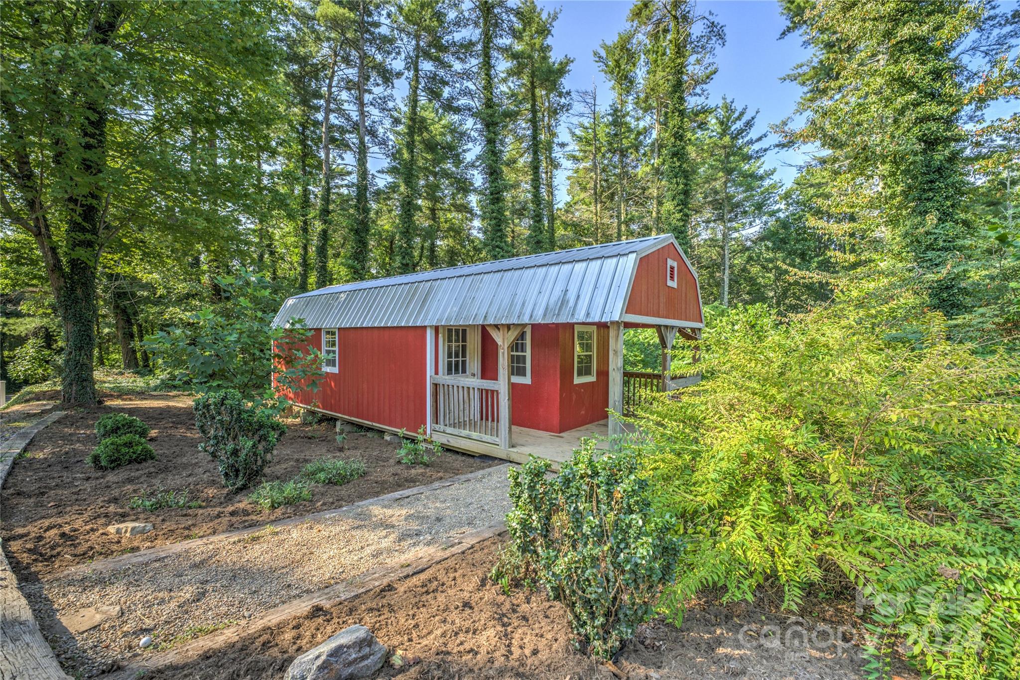 911 Jupiter Road Weaverville, NC 28787 - Photo 27 of 39 a view of a house with a yard and large trees