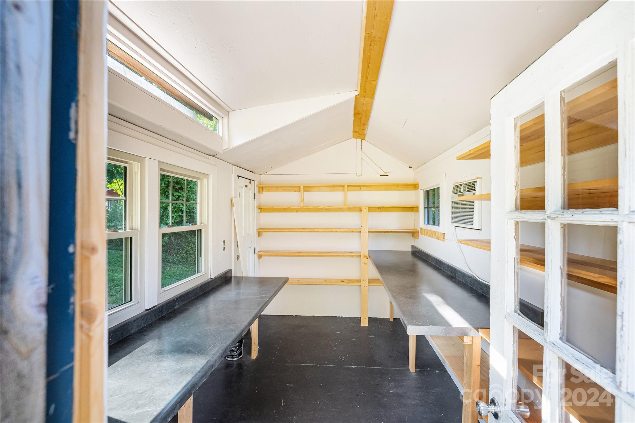 911 Jupiter Road Weaverville, NC 28787 - Photo 32 of 39 a view of a porch with wooden floor and windows