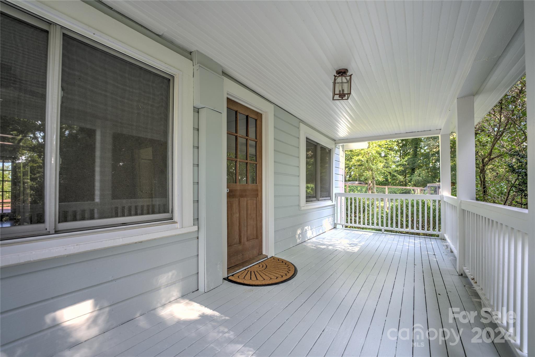 911 Jupiter Road Weaverville, NC 28787 - Photo 4 of 39 a view of a room with wooden floor and outdoor space