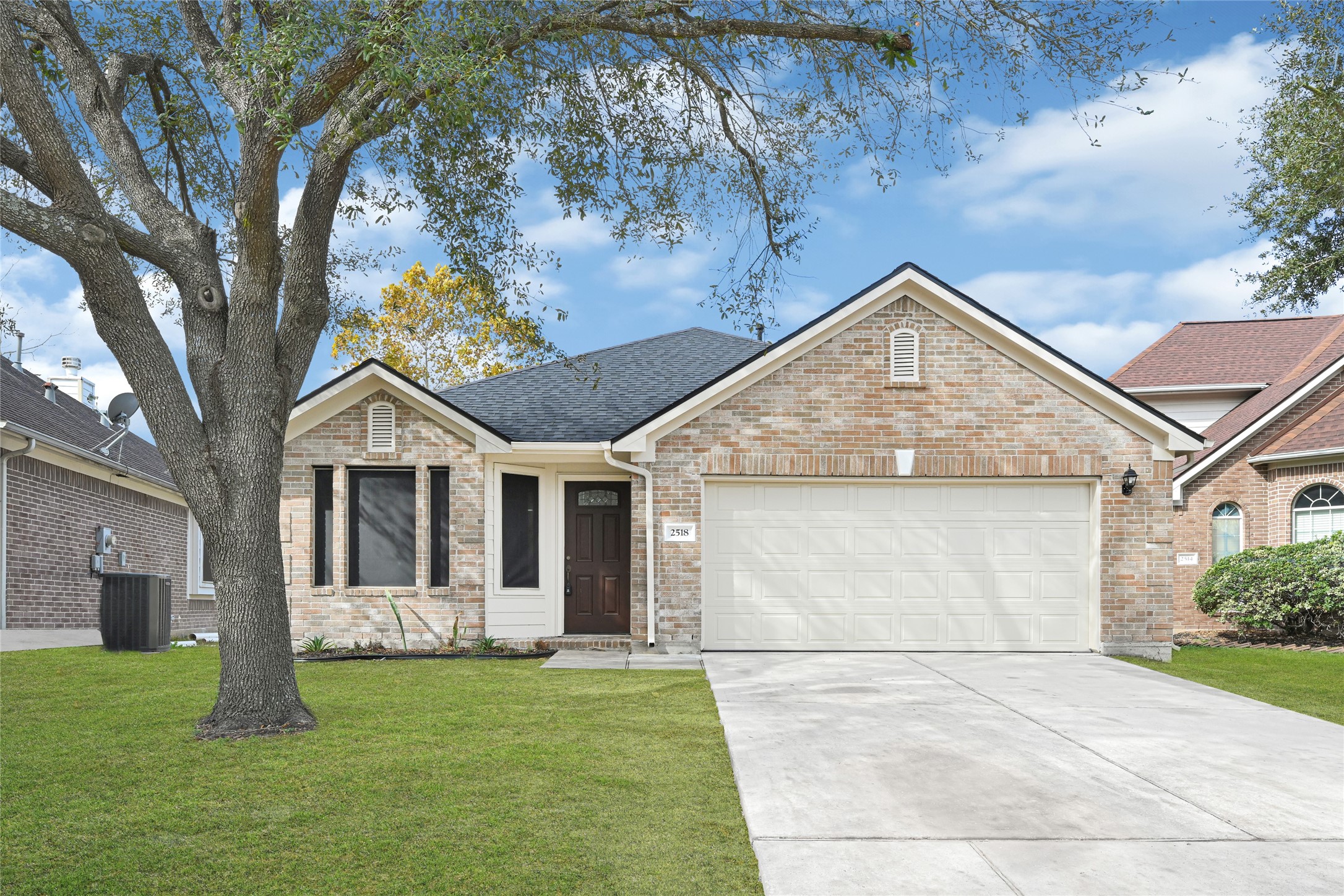 2518 Forge Creek Road Houston, TX 77067 - Photo 1 of 25 a front view of a house with a garden and yard