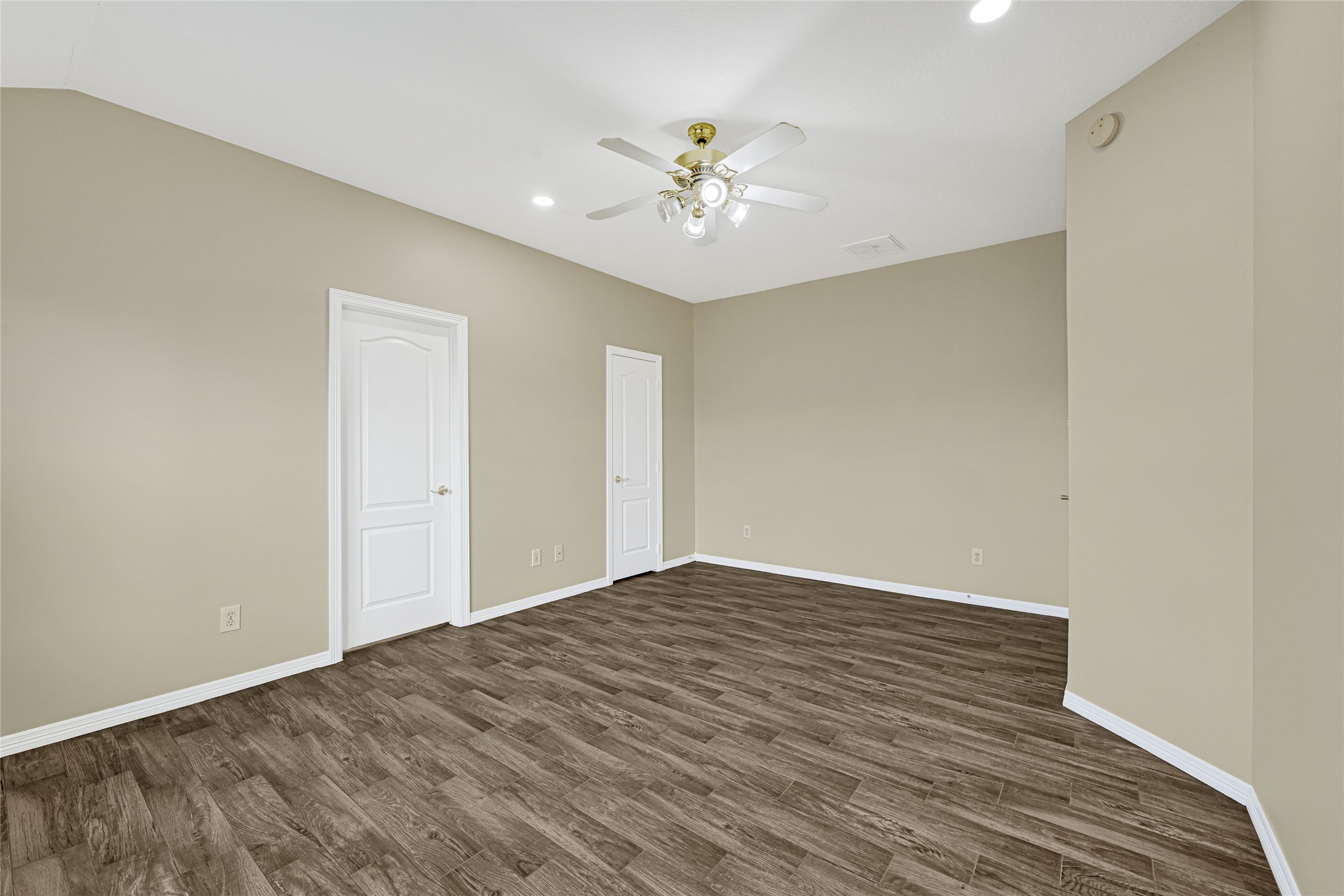 2518 Forge Creek Road Houston, TX 77067 - Photo 16 of 25 a view of an empty room with wooden floor
