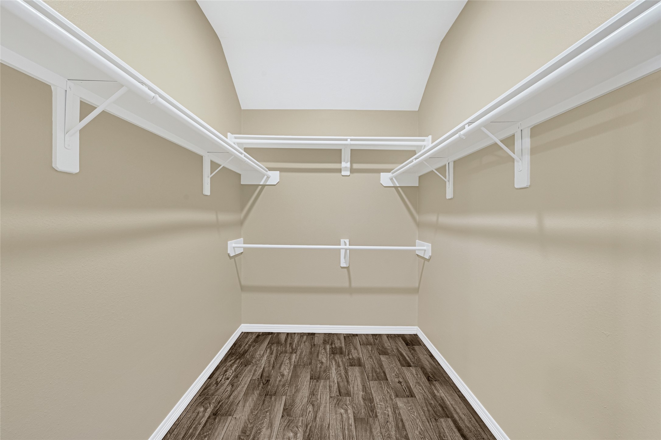 2518 Forge Creek Road Houston, TX 77067 - Photo 17 of 25 a view of walk in closet with empty racks