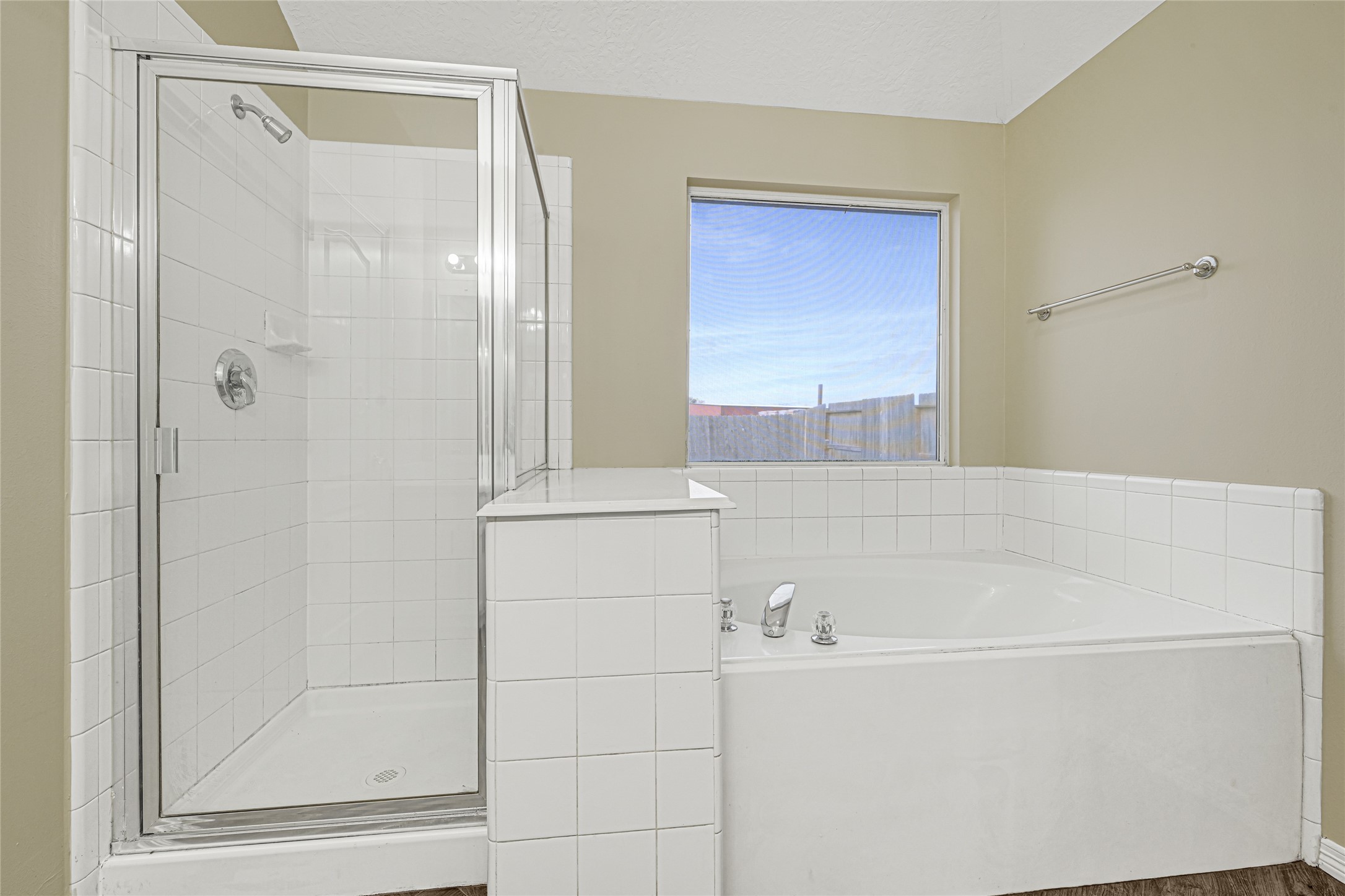 2518 Forge Creek Road Houston, TX 77067 - Photo 19 of 25 a bathroom with a bathtub and a shower