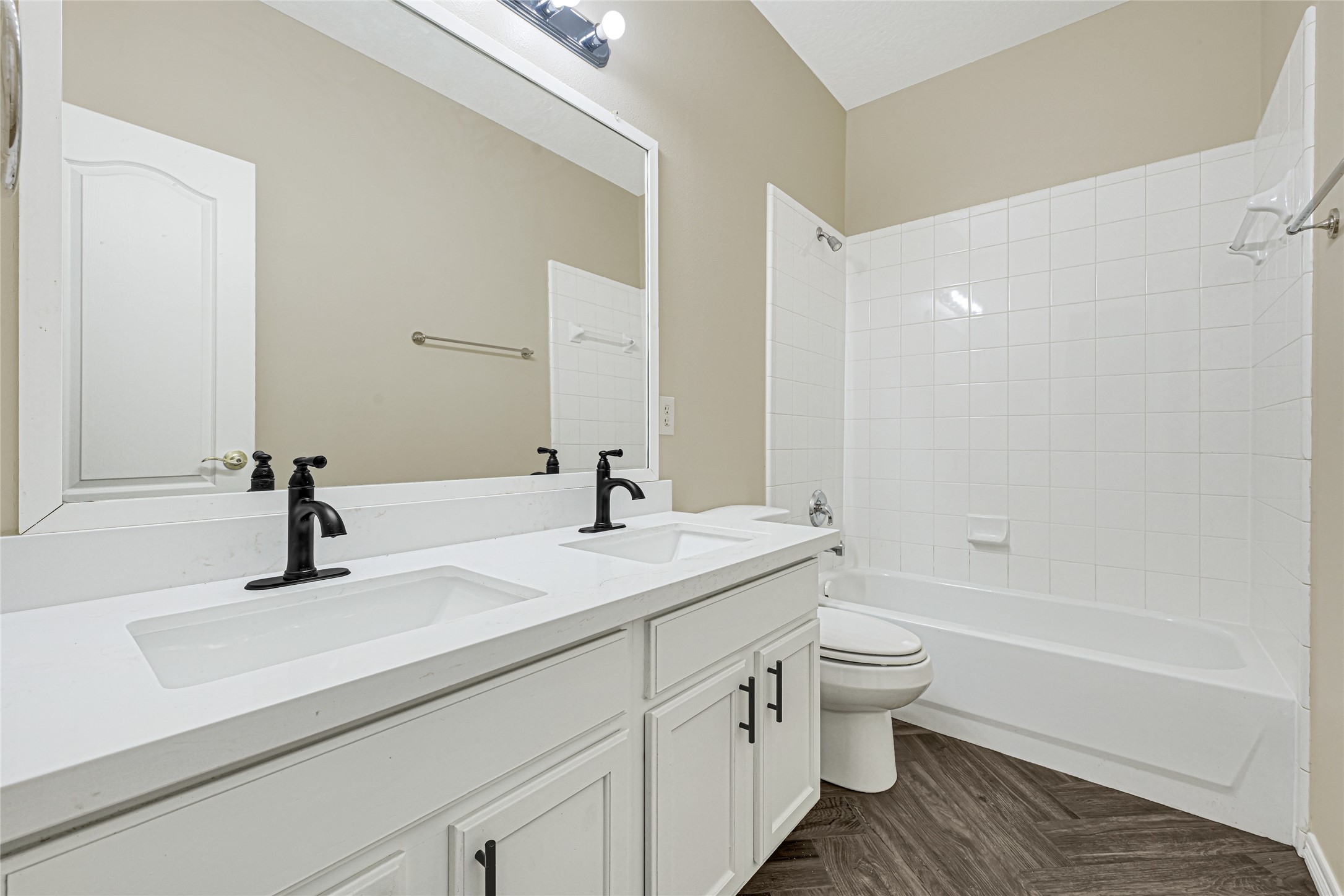 2518 Forge Creek Road Houston, TX 77067 - Photo 21 of 25 a bathroom with a double vanity sink toilet mirror and bathtub