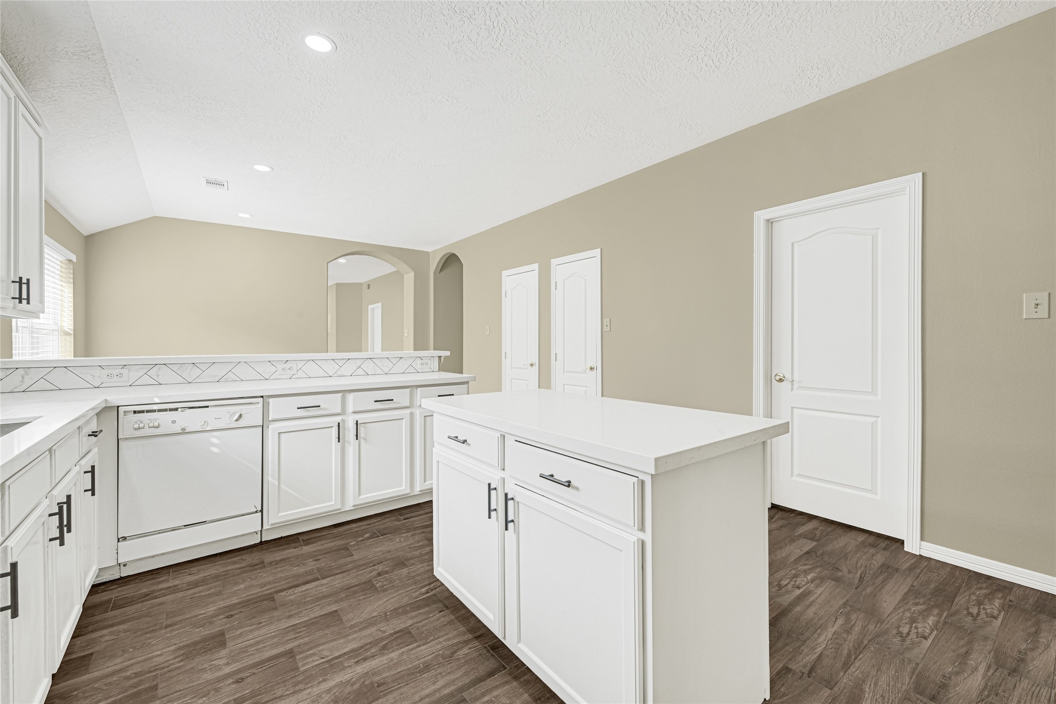 2518 Forge Creek Road Houston, TX 77067 - Photo 9 of 25 a kitchen with granite countertop white cabinets and white appliances