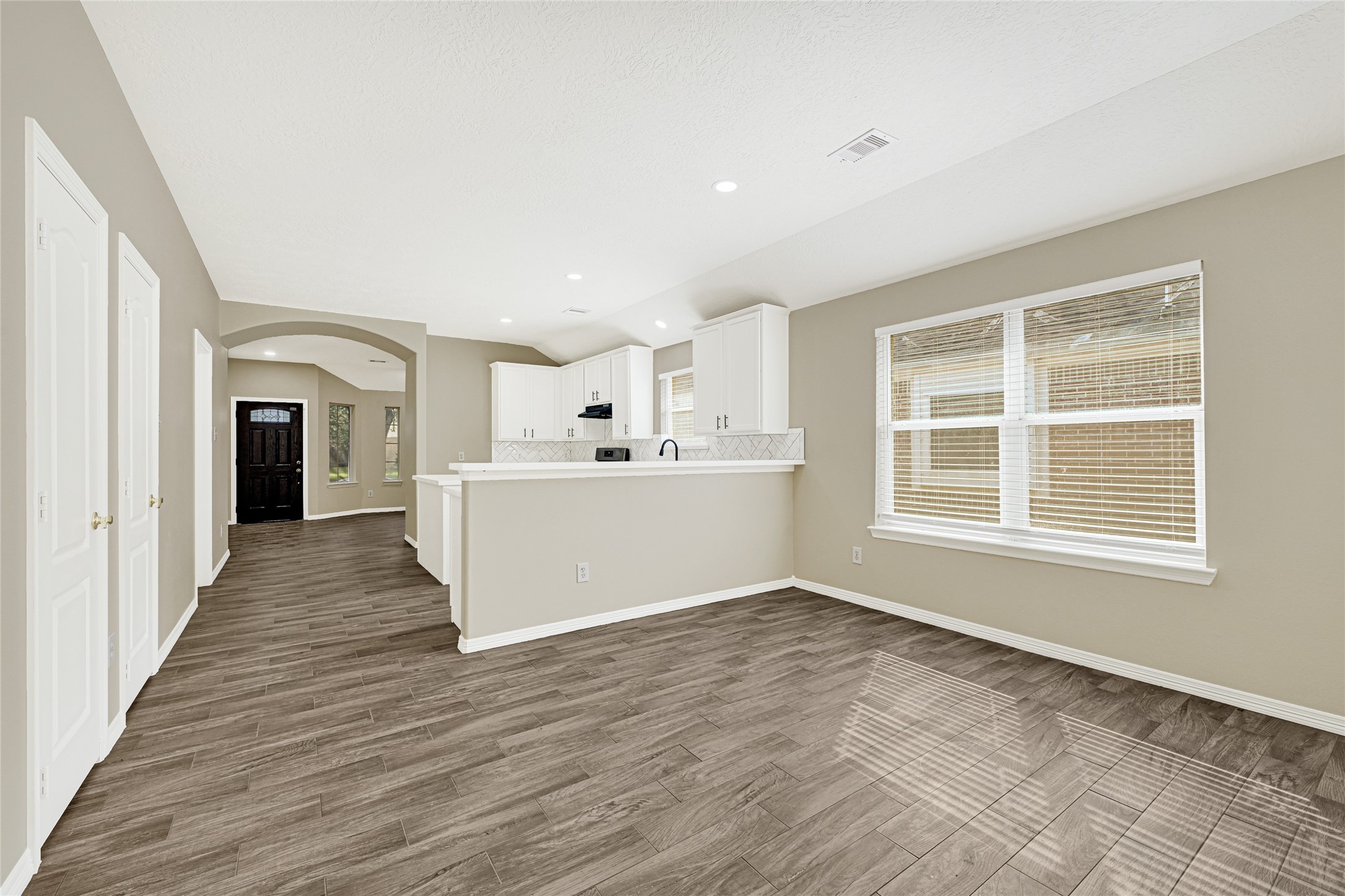 2518 Forge Creek Road Houston, TX 77067 - Photo 10 of 25 a view of a kitchen with wooden floor and a window