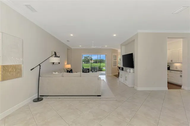 a kitchen with stainless steel appliances granite countertop a stove refrigerator and sink