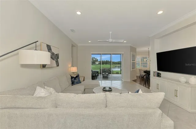 a view of a dining room with furniture window and outside view