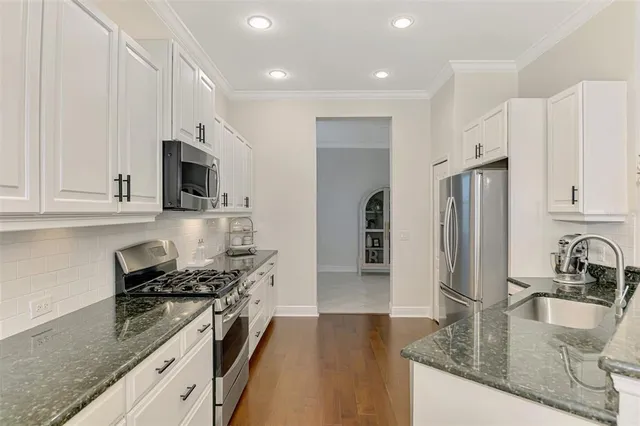 a bathroom with a sink a mirror and a shower