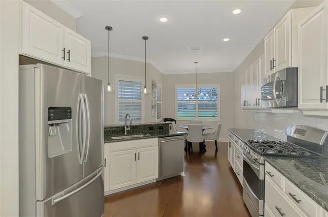 a bedroom with a bed couch and a window