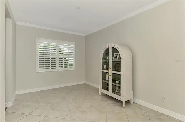 an aerial view of a house with a garden and lake view