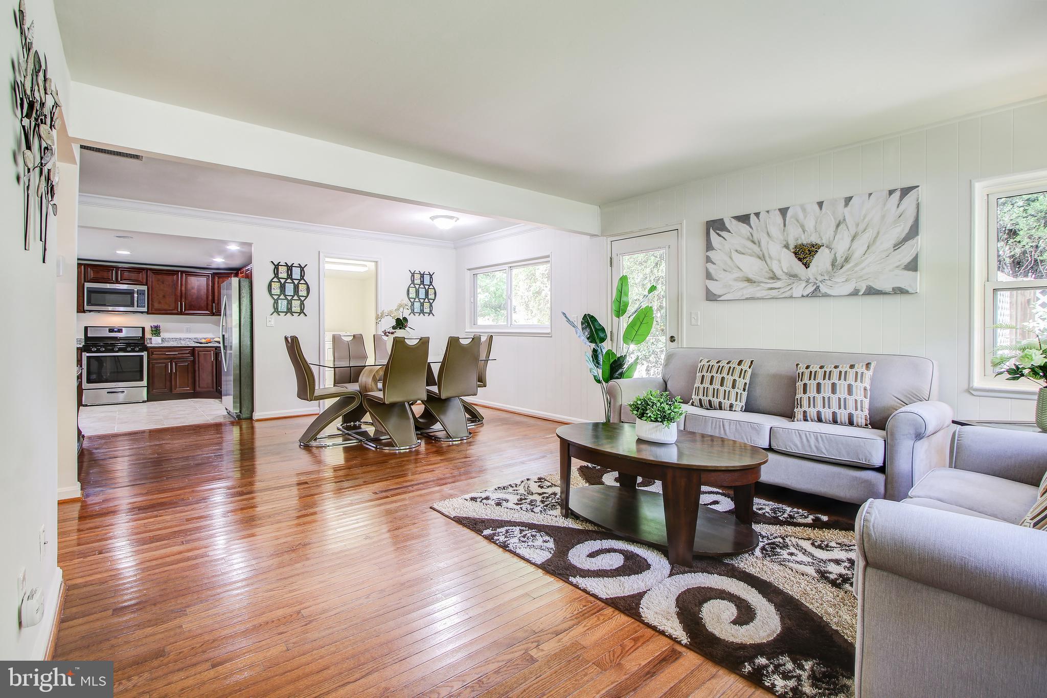 702 Dryden Street Silver Spring, MD 20901 - Photo 1 of 31 a living room with furniture and wooden floor
