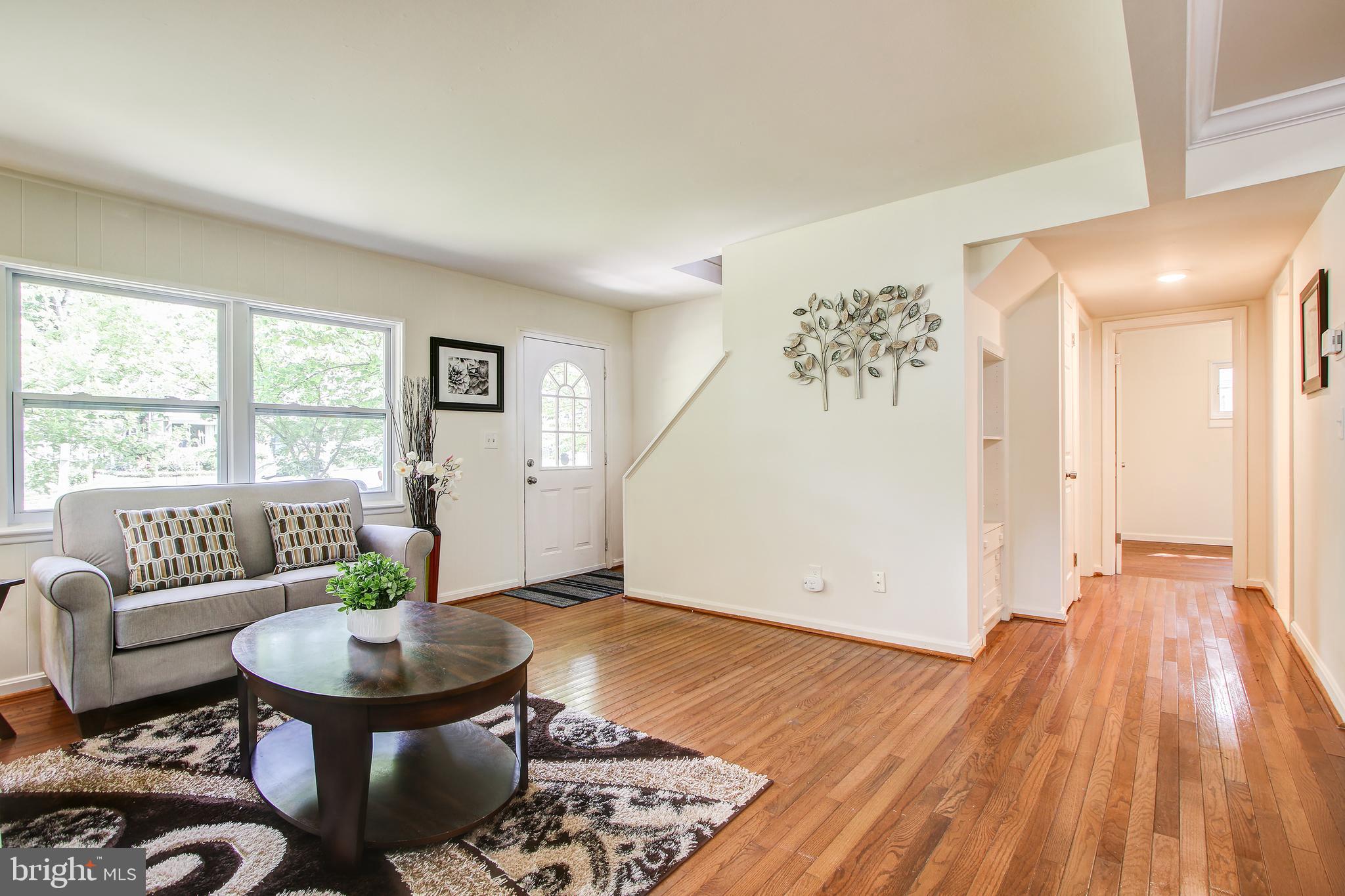 702 Dryden Street Silver Spring, MD 20901 - Photo 11 of 31 a living room with furniture and a table
