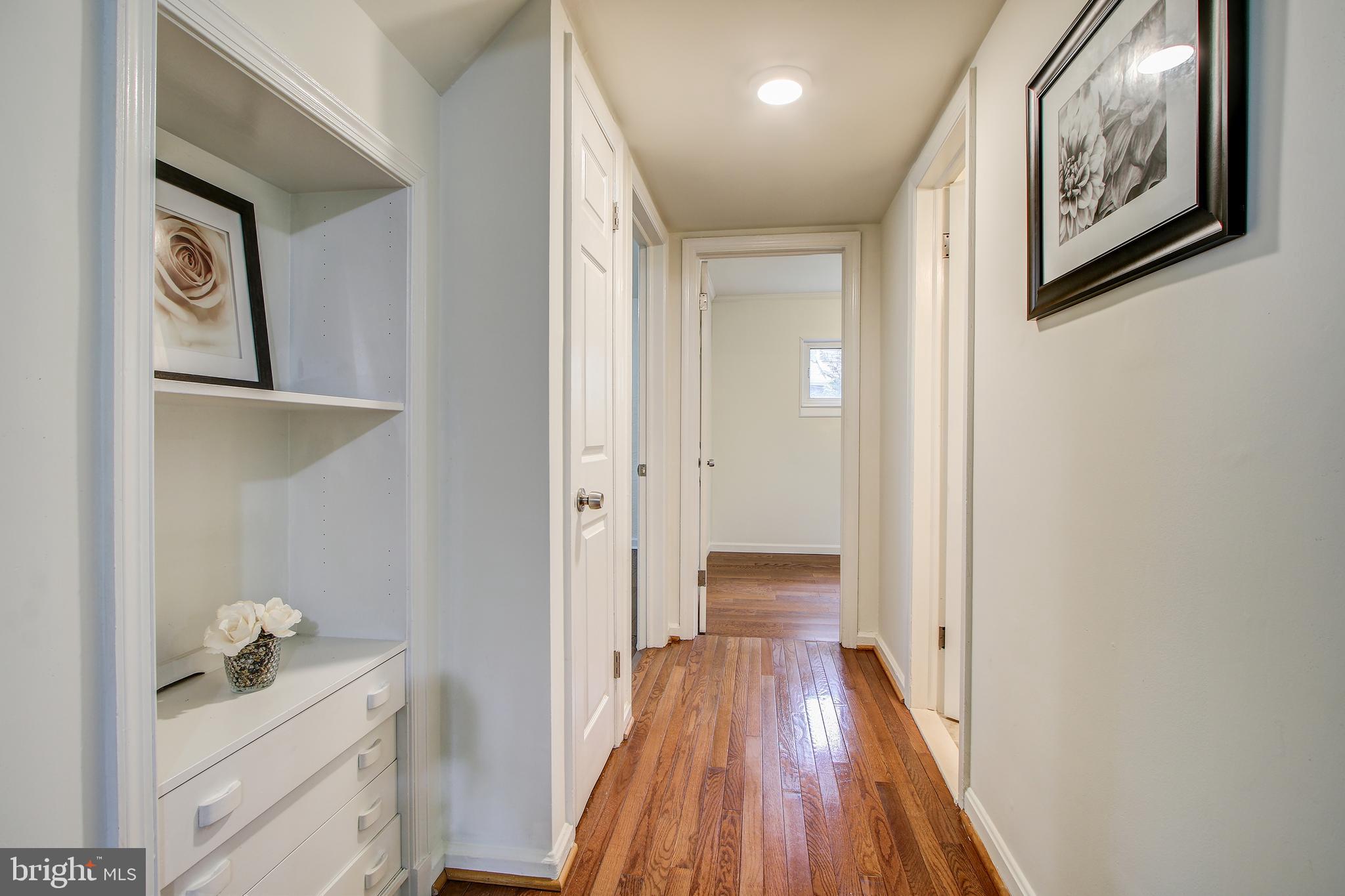 702 Dryden Street Silver Spring, MD 20901 - Photo 12 of 31 a view of a hallway with wooden floor and closet