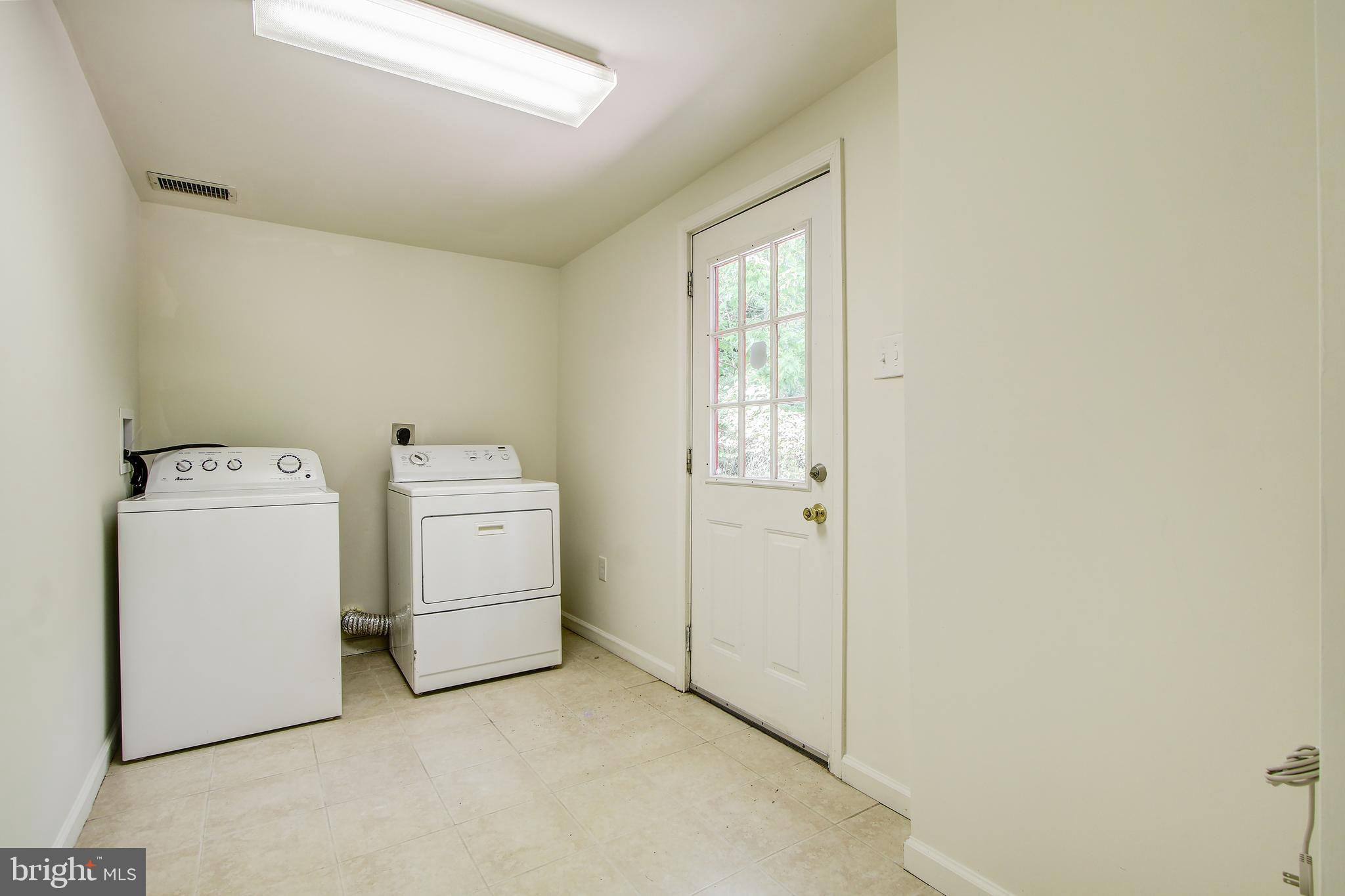 702 Dryden Street Silver Spring, MD 20901 - Photo 23 of 31 a view of a room with dryer and washer